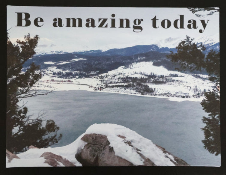 Canvas print with scenic winter view of a lake and mountains with 'Be amazing today' text.