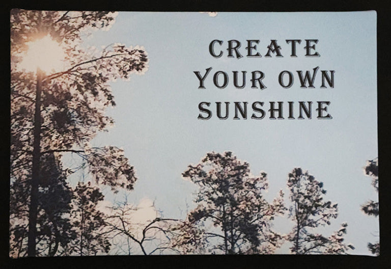 Canvas print with scenic trees and sunlight with 'Create Your Own Sunshine' text.