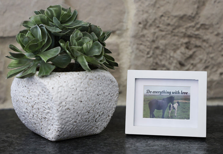 Framed picture with 'Do everything with love' quote.