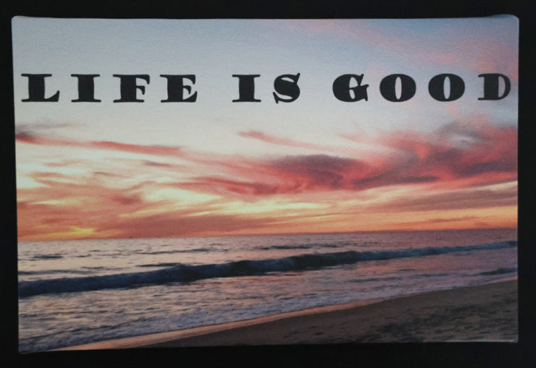 Canvas print with scenic sunset over the ocean with 'Life is good' text.