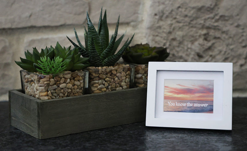 Framed picture with 'You know the answer' quote.