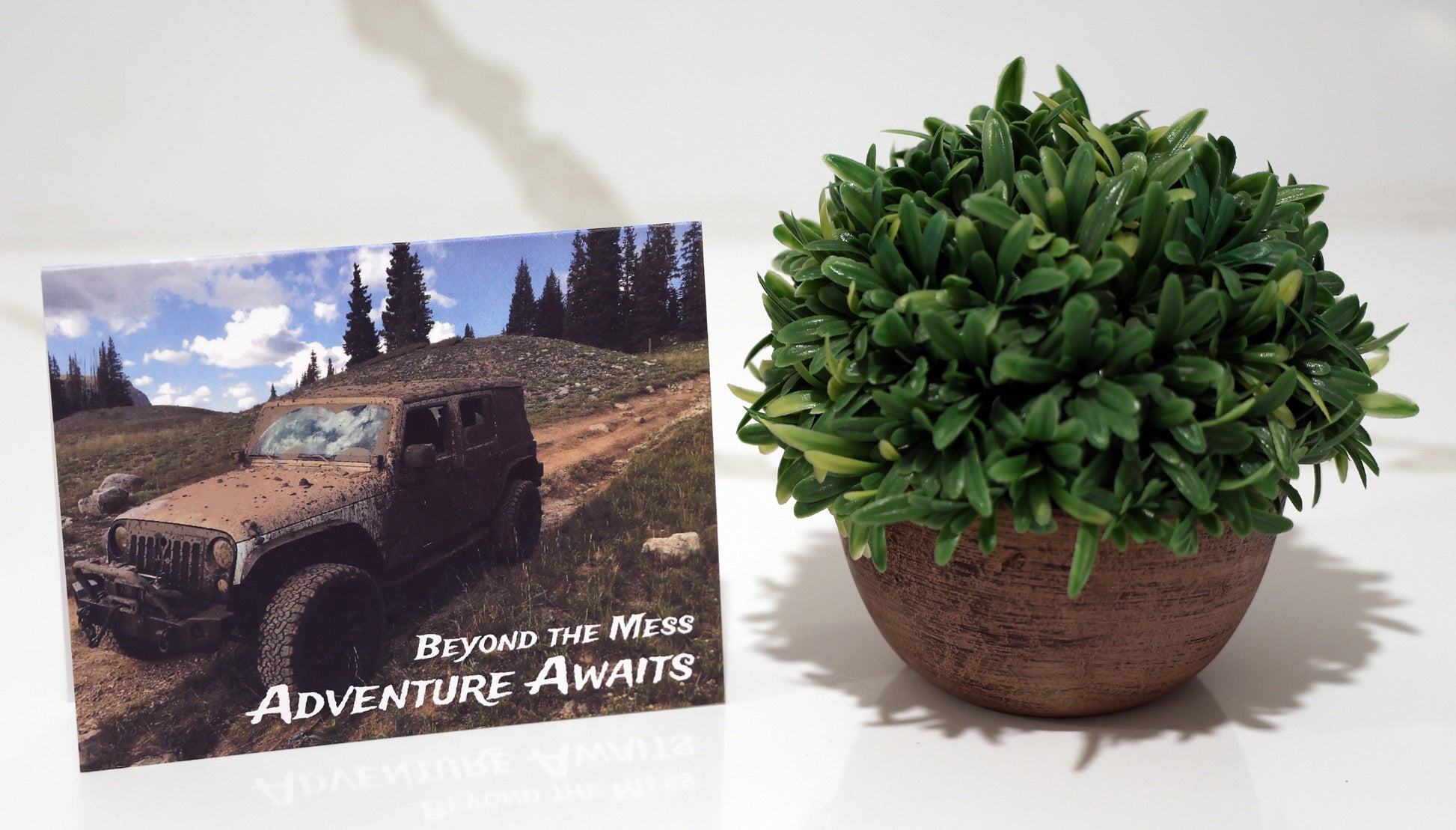 Note card with offroad jeep and "Adventure Awaits" quote.