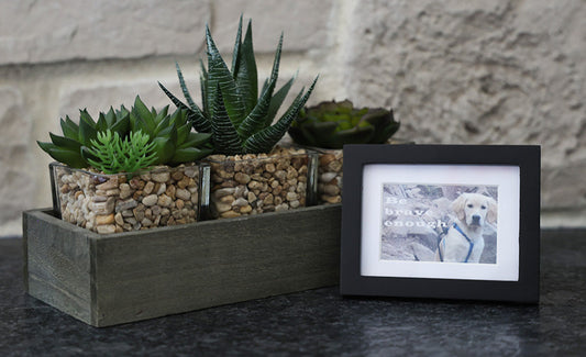 Framed picture with 'Be brave enough' quote.