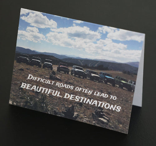 Note card with line of jeeps in scenic mountains and "Beautiful Destinations" quote.