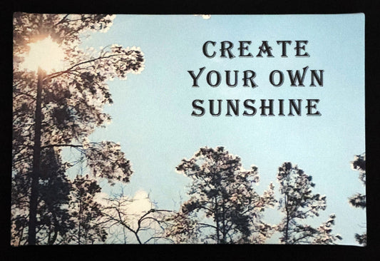 Canvas print with scenic trees and sunlight with 'Create Your Own Sunshine' text.