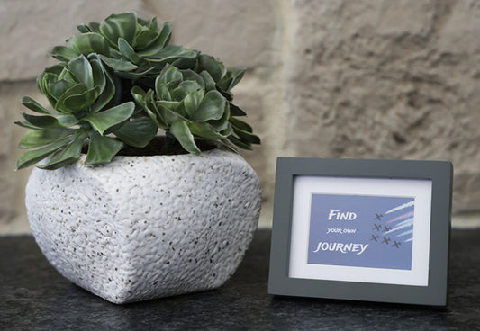 Framed picture with 'Find your own journey' quote.
