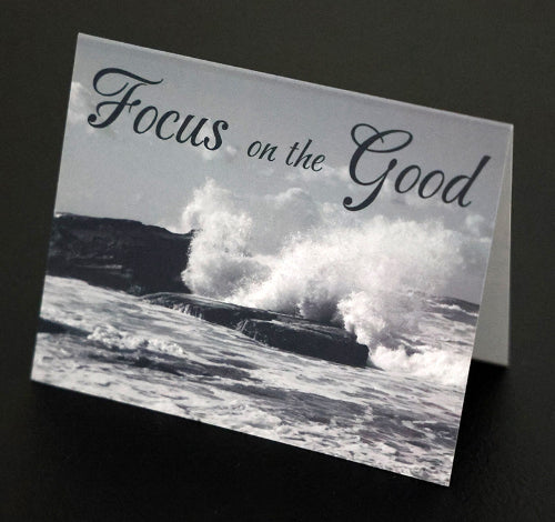 Note card with scenic beach and "Focus on the good" quote.