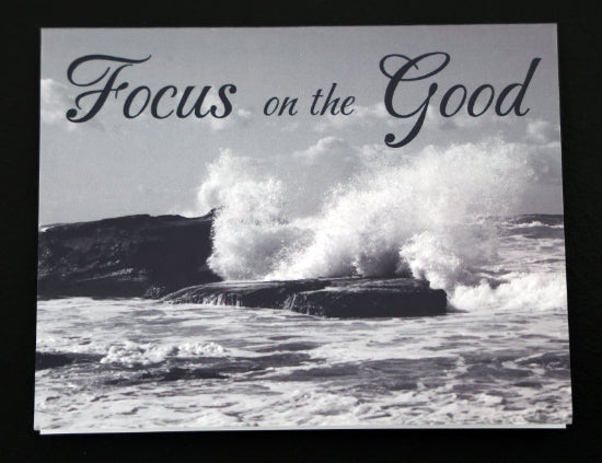 Note card with scenic beach and "Focus on the good" quote.