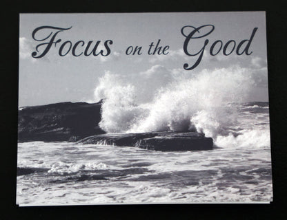 Note card with scenic beach and "Focus on the good" quote.