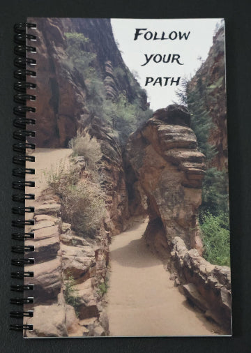 Journal with a scenic rock formation on the cover and 'Follow Your Path' text.