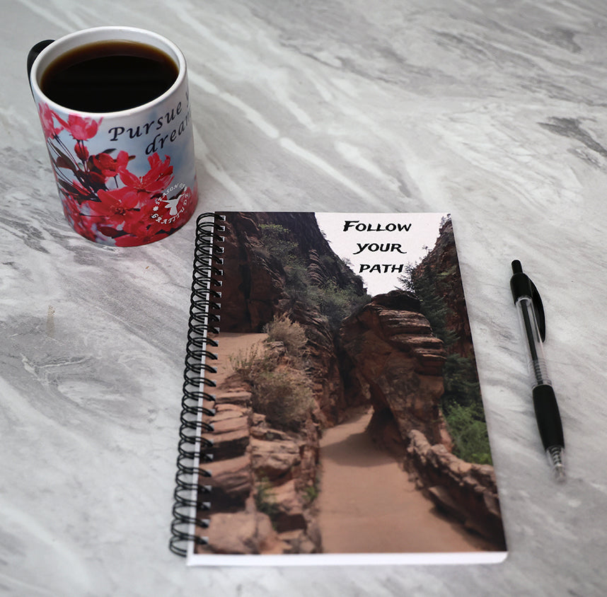 Journal with a scenic rock formation on the cover and 'Follow Your Path' text.