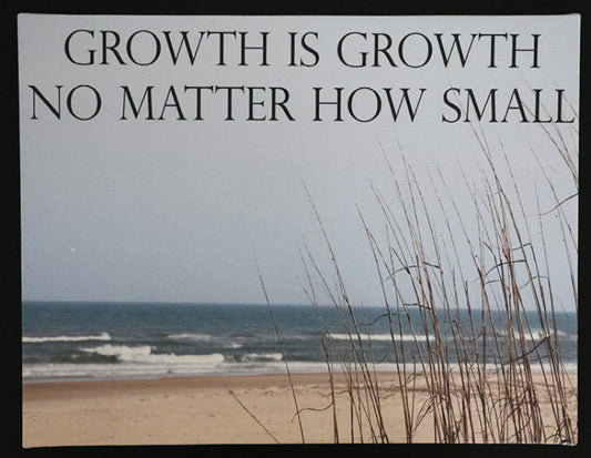 Canvas print with scenic beach scene with ocean and grass with 'Growth is growth no matter how small' text.