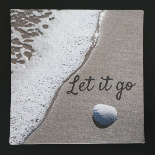 Canvas print with scenic view of a beach and shell, with 'Let it go' text.