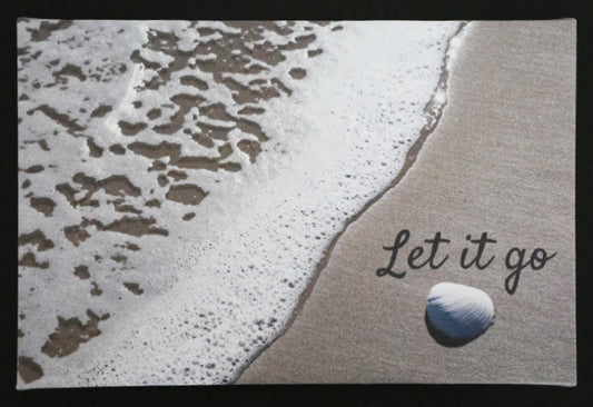 Canvas print with scenic a shell and waves on a beach with 'Let it go' text.