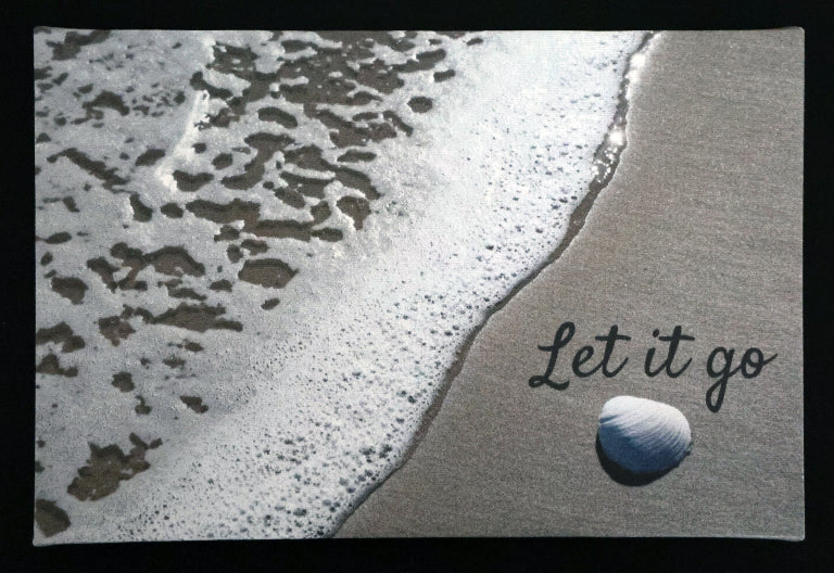 Canvas print with scenic a shell and waves on a beach with 'Let it go' text.