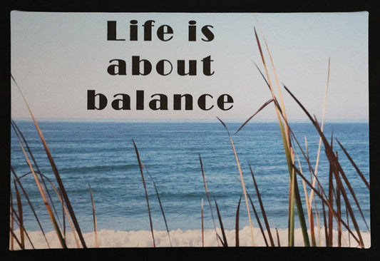 Canvas print with scenic beach scene with ocean and grass with 'Life is about balance' text.