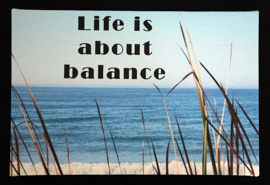 Canvas print with scenic beach scene with ocean and grass with 'Life is about balance' text.
