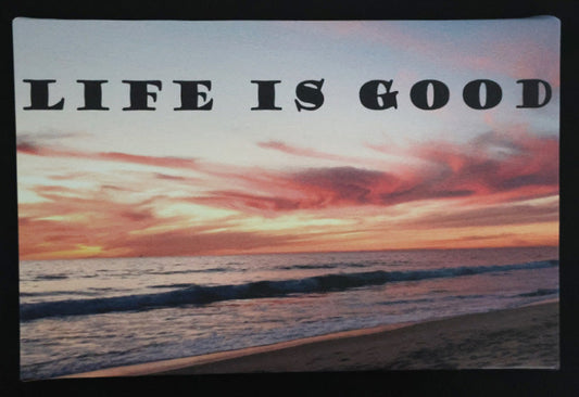 Canvas print with scenic sunset over the ocean with 'Life is good' text.