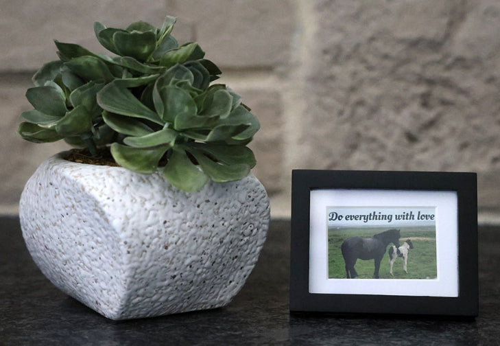 Framed picture with 'Do everything with love' quote.