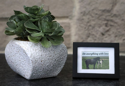 Framed picture with 'Do everything with love' quote.