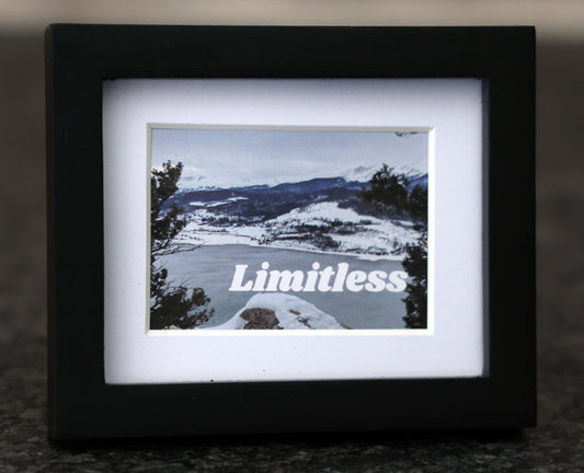 Framed picture with 'Be Limitless' quote.