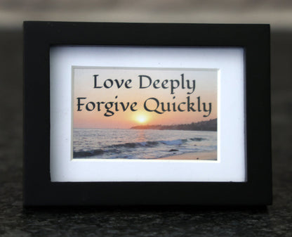 Framed picture with 'Love Deeply, Forgive Quickly' quote.