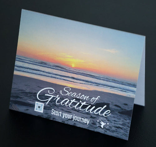 Note card with scenic beach and "Season of Gratitude" quote.