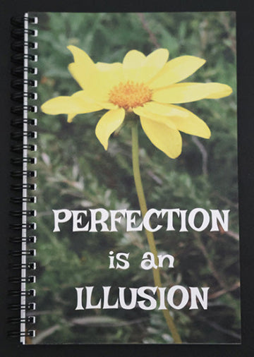 Journal cover with a yellow flower and text 'Perfection is an Illusion' on a green background.