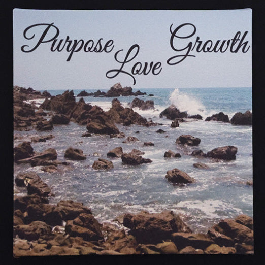 Canvas print with scenic ocean by the rocks with 'Purpose', 'Growth', and 'Love' text.