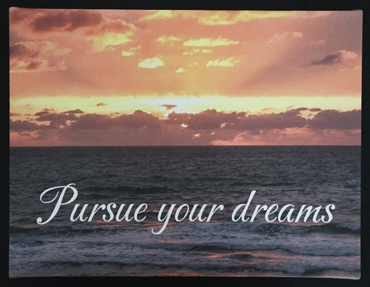 Canvas print with scenic sunset over the ocean with 'Pursue your dreams' text.