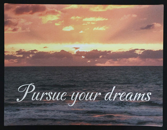 Canvas print with scenic sunset over the ocean with 'Pursue your dreams' text.