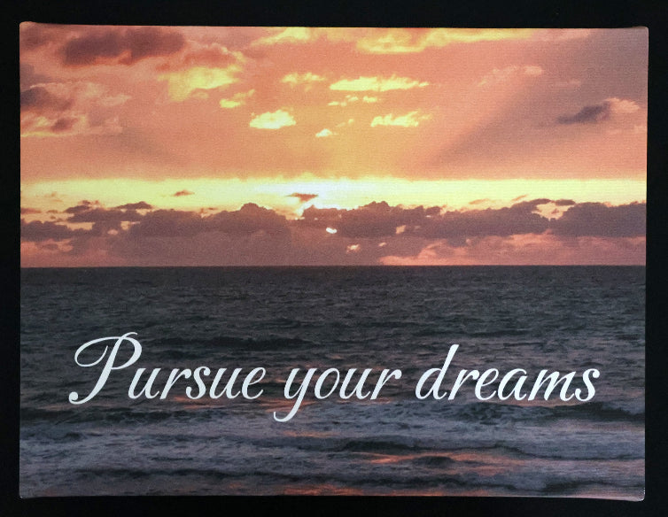 Canvas print with scenic sunset over the ocean with 'Pursue your dreams' text.