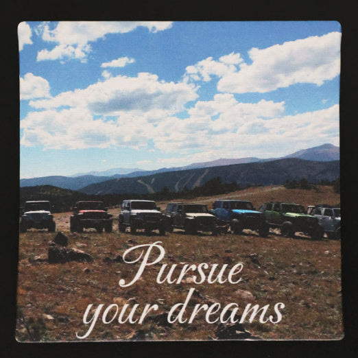 Canvas print with jeeps in a scenic view of the mountains, with 'Pursue your dreams' text.