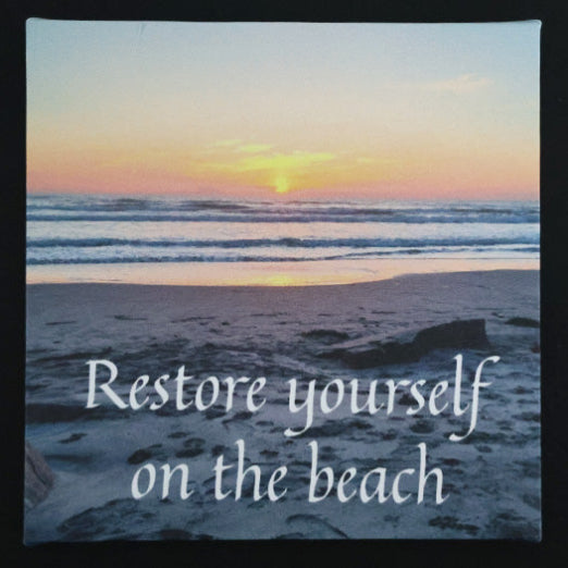 Canvas print with scenic beach sunset with 'Restore yourself on the beach' text.
