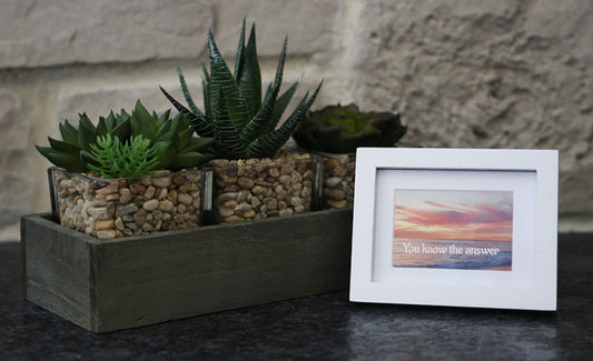 Framed picture with 'You  know the answer' quote.